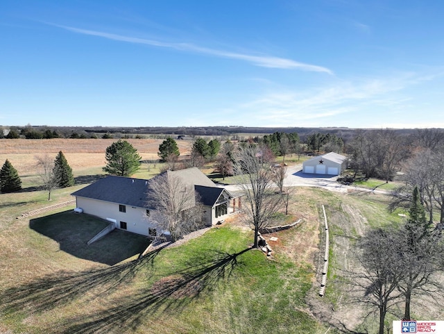 birds eye view of property with a rural view