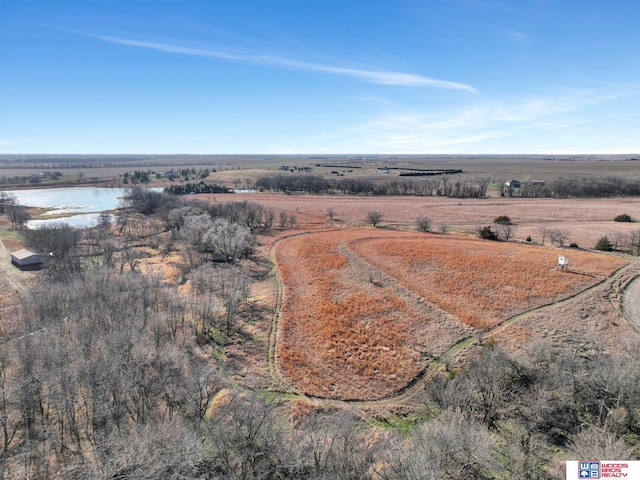 aerial view with a water view and a rural view