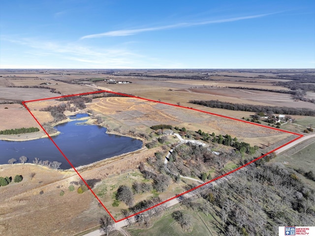 aerial view with a rural view and a water view