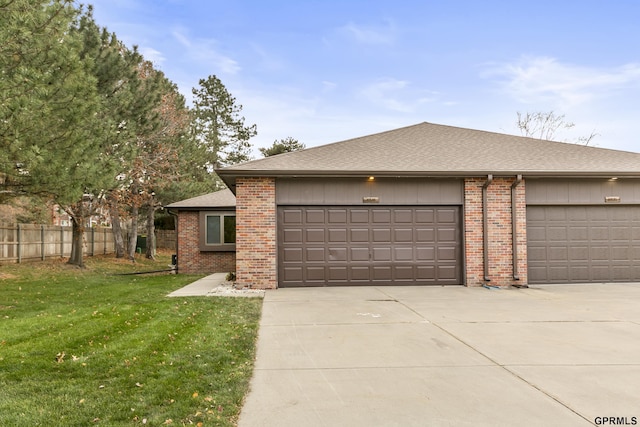 view of front facade featuring a garage and a front lawn