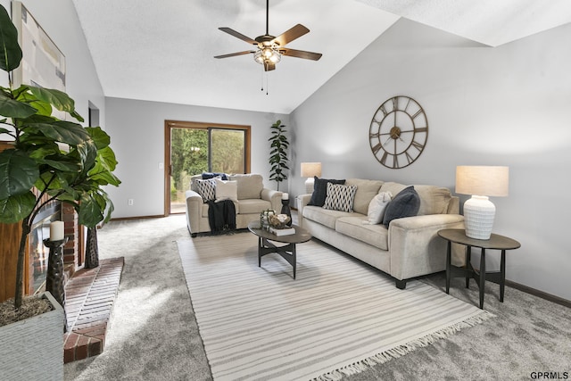 carpeted living room with ceiling fan and high vaulted ceiling