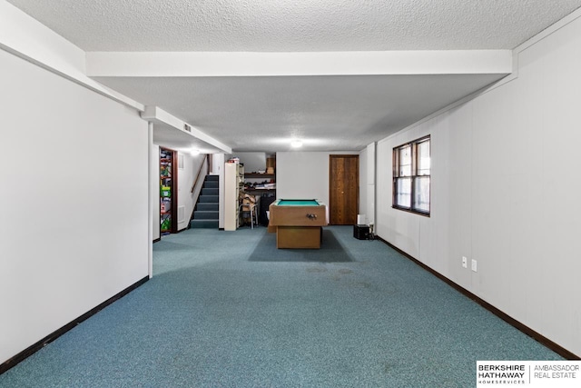 playroom featuring carpet, a textured ceiling, and pool table