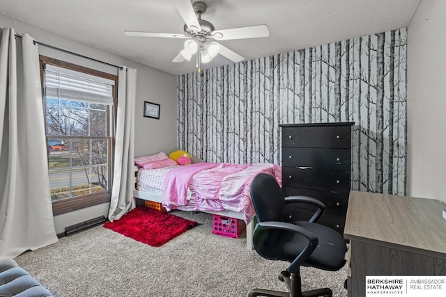 bedroom featuring carpet flooring, ceiling fan, and a textured ceiling