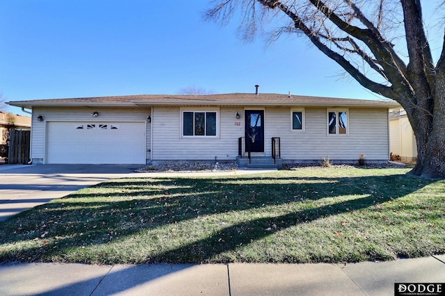 single story home featuring a garage and a front lawn