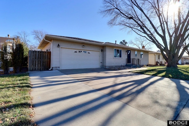 ranch-style home with a garage and a front yard