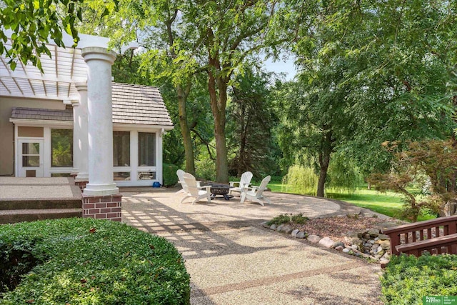 view of patio with a fire pit