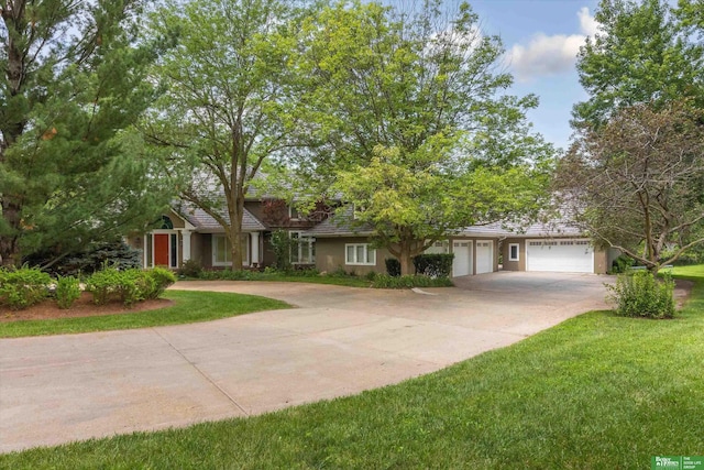 view of front of home featuring a garage and a front lawn