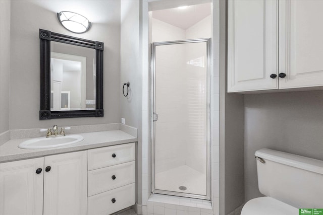 bathroom featuring vanity, toilet, and a shower with door