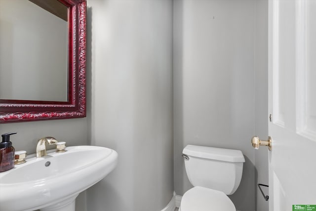 bathroom with toilet and sink