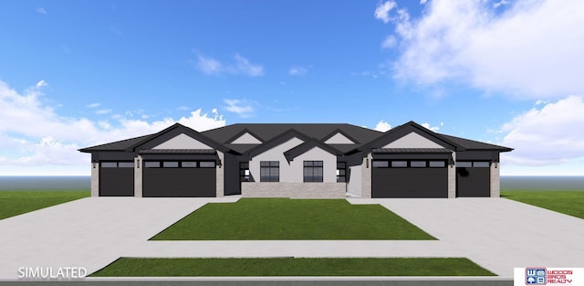 view of front of house with a garage and a front yard