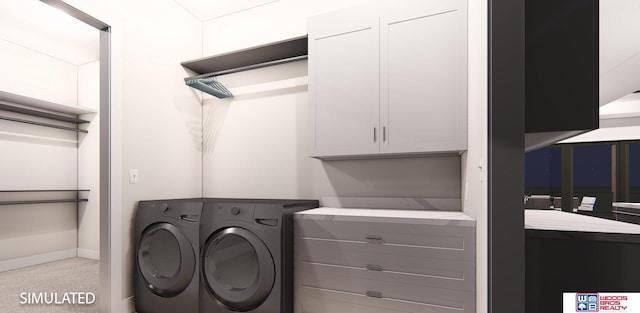 laundry area with separate washer and dryer and cabinets