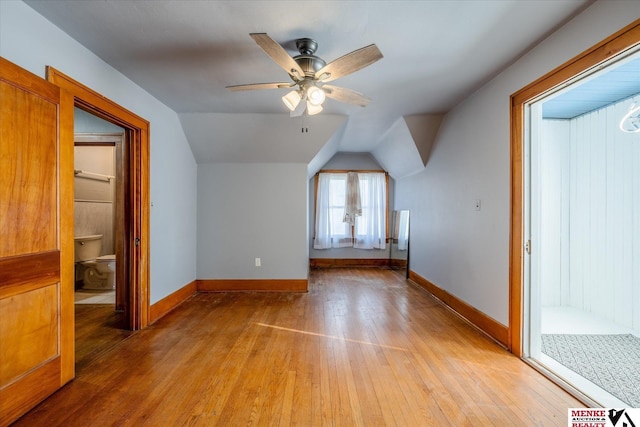 additional living space featuring ceiling fan, lofted ceiling, and light wood-type flooring