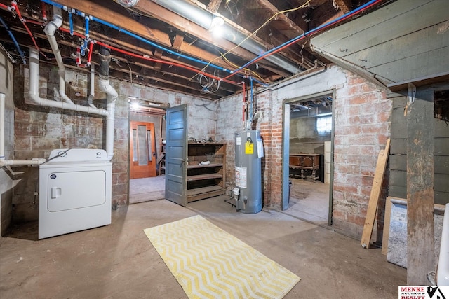 basement featuring gas water heater and washer / clothes dryer