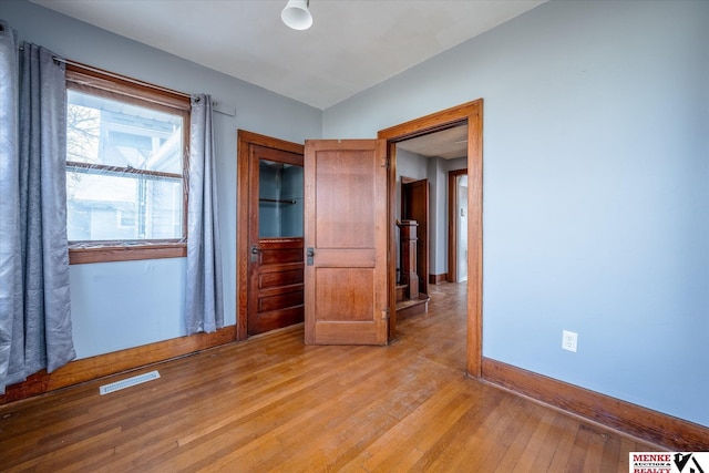 unfurnished bedroom featuring light hardwood / wood-style floors