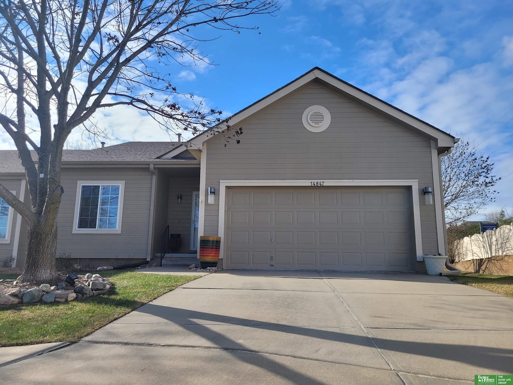 ranch-style house featuring a garage