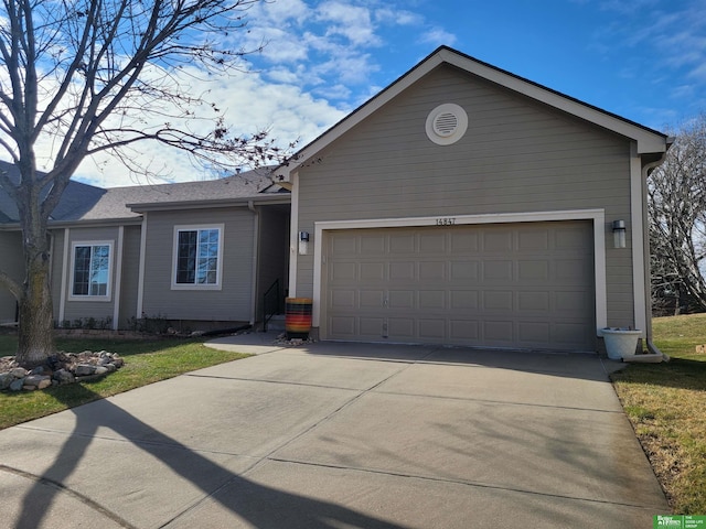 ranch-style house featuring a garage