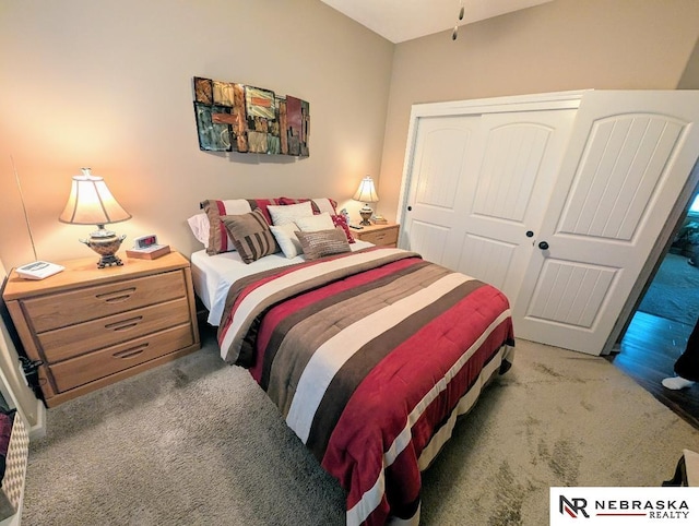 carpeted bedroom with a closet