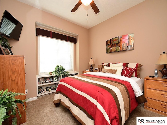 bedroom featuring ceiling fan and dark colored carpet