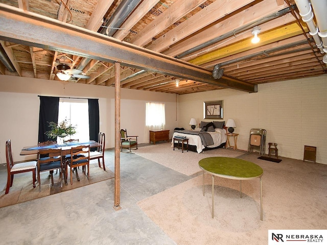 basement featuring ceiling fan and a wealth of natural light