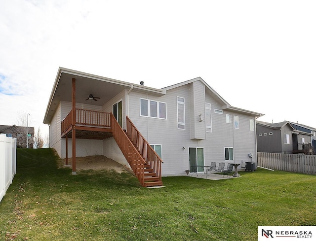 back of property featuring ceiling fan, a patio, central air condition unit, and a lawn