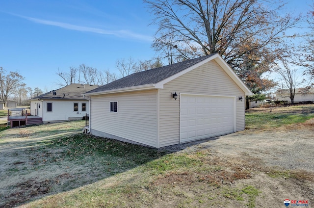 garage with a lawn