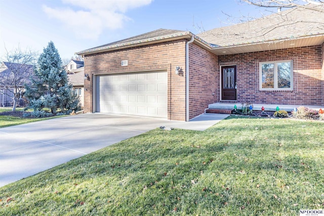 view of front of property featuring a garage and a front lawn