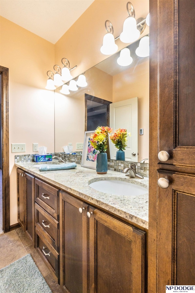 bathroom featuring tile patterned flooring and vanity