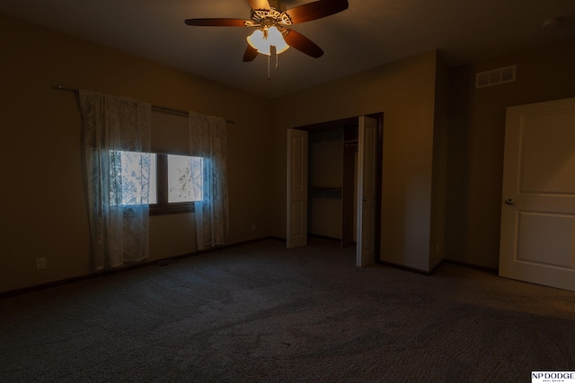 unfurnished bedroom featuring carpet flooring, ceiling fan, and a closet