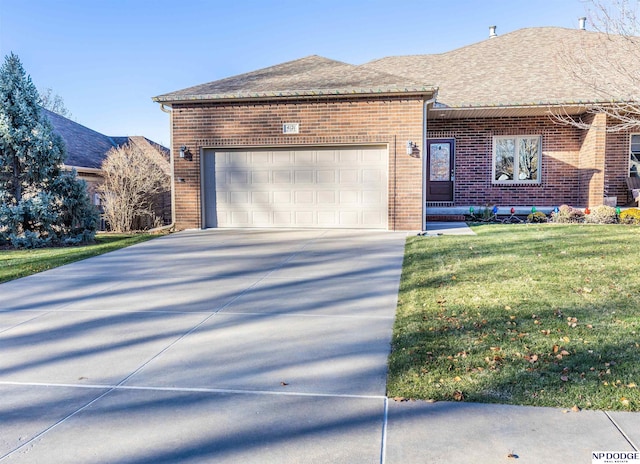 view of front of property featuring a garage and a front yard