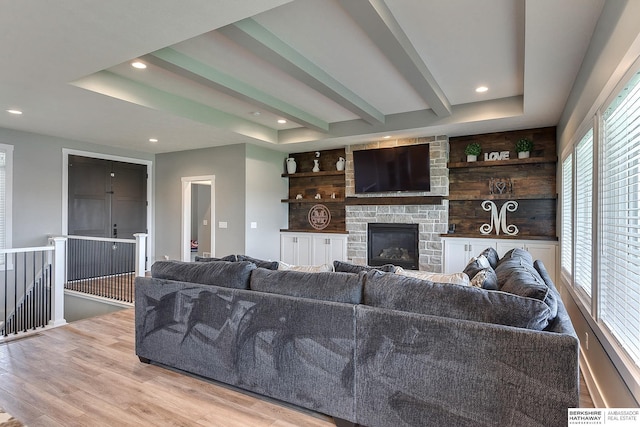 living room with a fireplace and light hardwood / wood-style floors