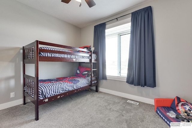 carpeted bedroom with ceiling fan