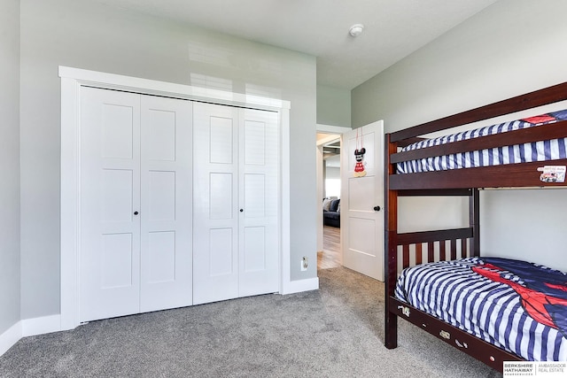 carpeted bedroom with a closet