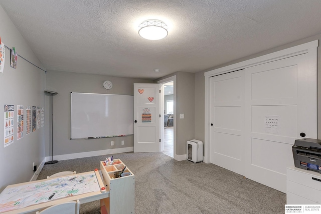 interior space with carpet and a textured ceiling