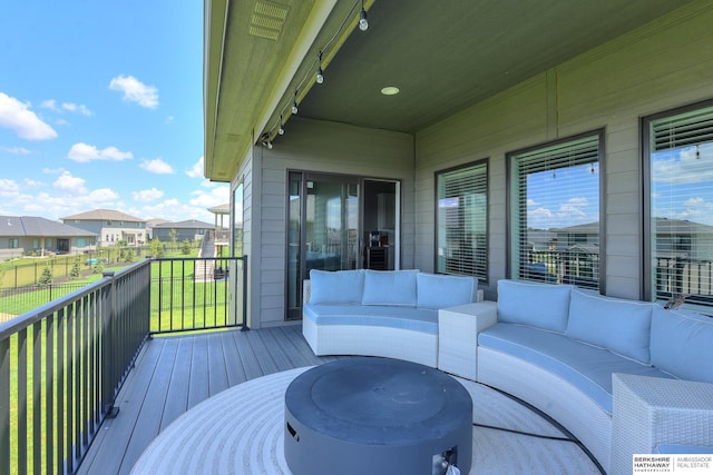 wooden deck featuring an outdoor hangout area