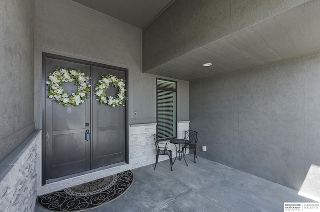 property entrance featuring french doors