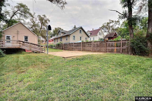 view of yard with a wooden deck