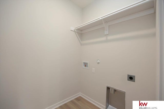 washroom with electric dryer hookup, hookup for a gas dryer, washer hookup, and wood-type flooring