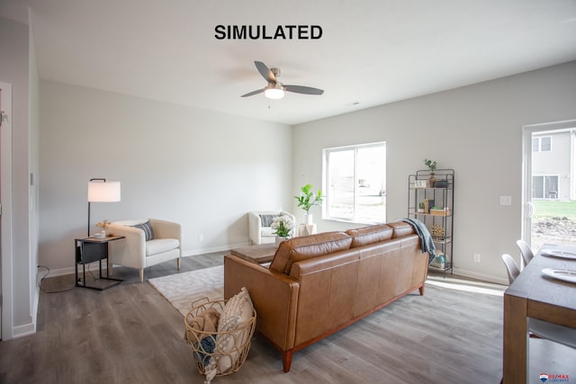 living room with light hardwood / wood-style floors and ceiling fan