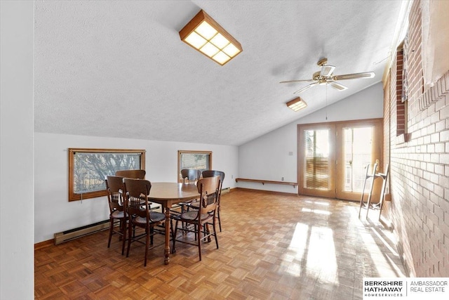 dining space with lofted ceiling, ceiling fan, a textured ceiling, a baseboard radiator, and brick wall