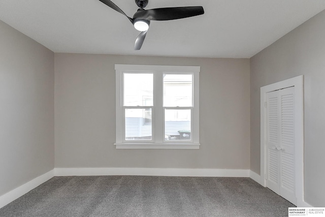 interior space featuring ceiling fan and carpet