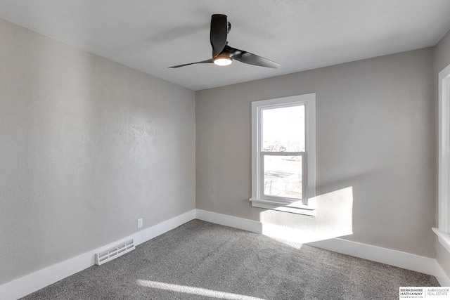 spare room with ceiling fan and carpet floors