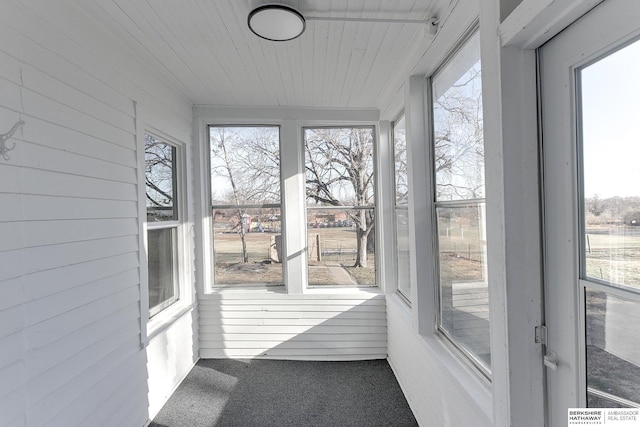 sunroom featuring wooden ceiling