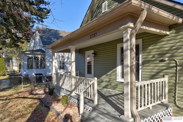 view of side of home with a wooden deck