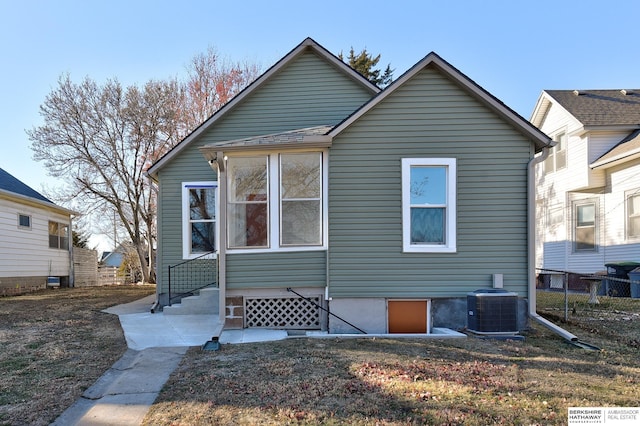 back of property with central air condition unit