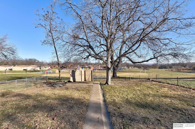 view of yard with a rural view