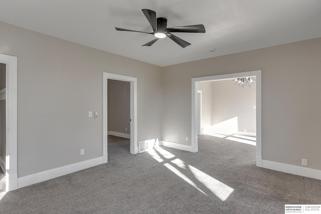 unfurnished room featuring ceiling fan and light carpet