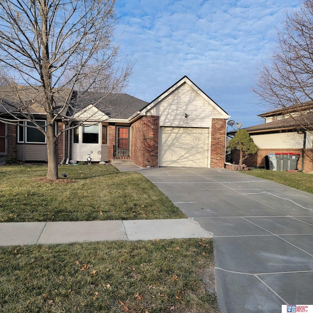 view of front of house with a front yard and a garage