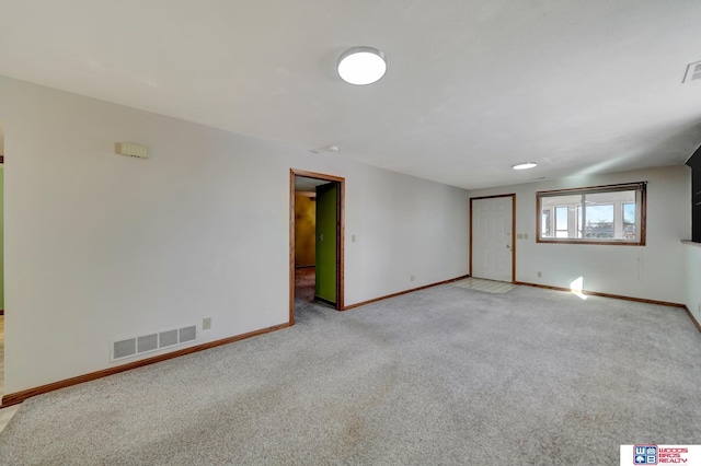 unfurnished room with light carpet