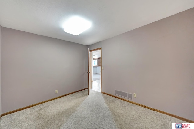 empty room featuring carpet flooring