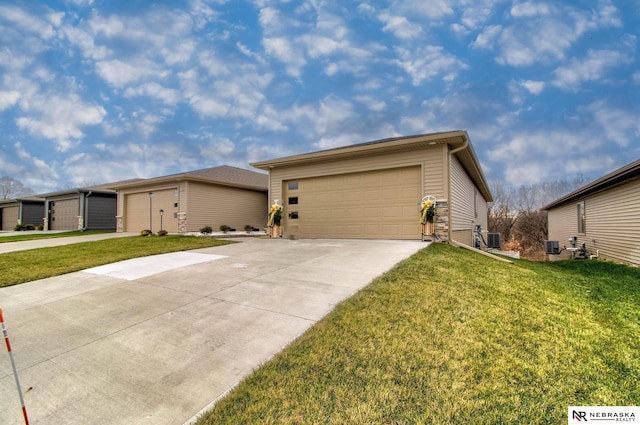 ranch-style home with cooling unit, a garage, and a front lawn